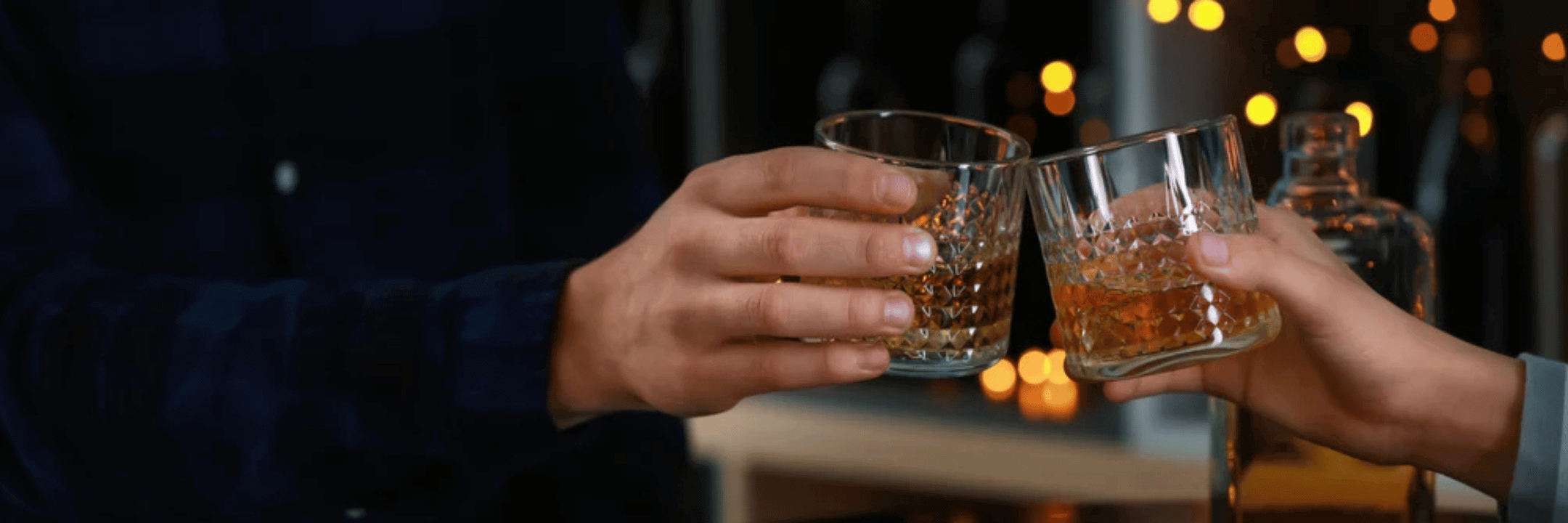 Whisky glass and toasting