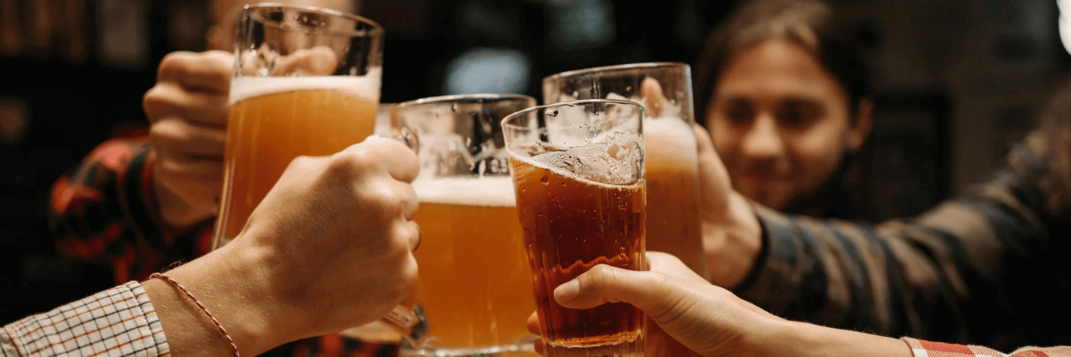 Toasting with beers in glass