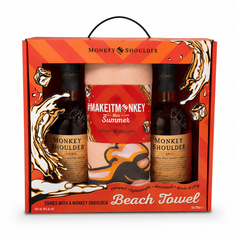 Monkey Shoulder gift set with two bottles and a beach towel in a decorative box.