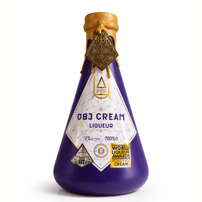 Purple bottle of Ube Cream Liqueur with a gold cap on a white background